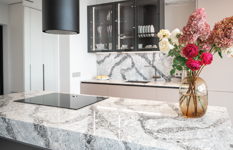 Updated 2000s Southlake TX kitchen with custom stone countertops and warm cabinetry