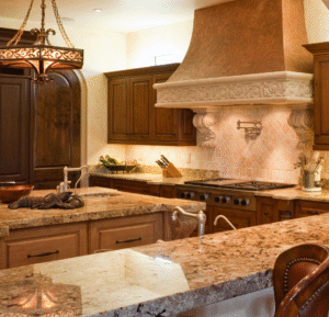 Updated Tuscan-style kitchen with light stone countertops in a Southlake, Texas home